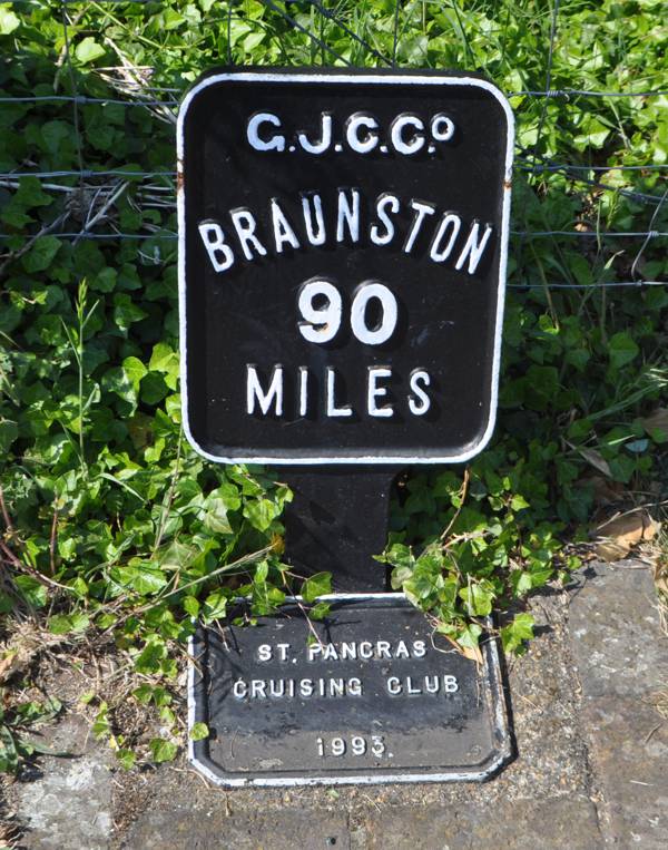 Grand Junction Canal restored milepost at Hanwell Black and white metal sign - Braunston 90 miles