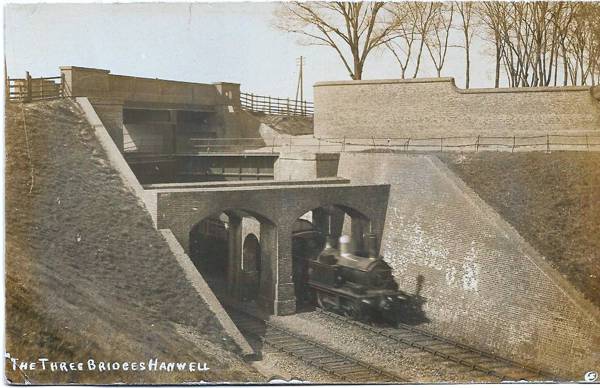 Three Bridges - pre-war passenger train passing, Norwood Green A steam locomotive passes beneath the canal and the road is above