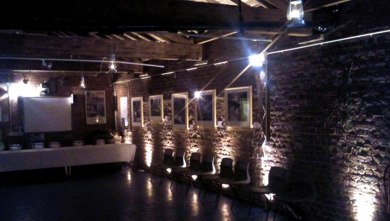 Darkened brick wall lit by up-lights