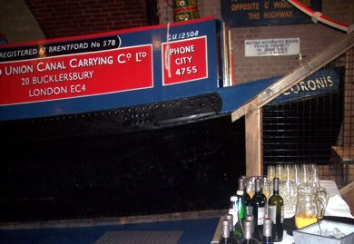 Drinks bar to foreground with red boat cabin behind