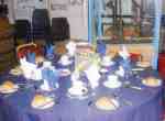 A rount table set for a meal